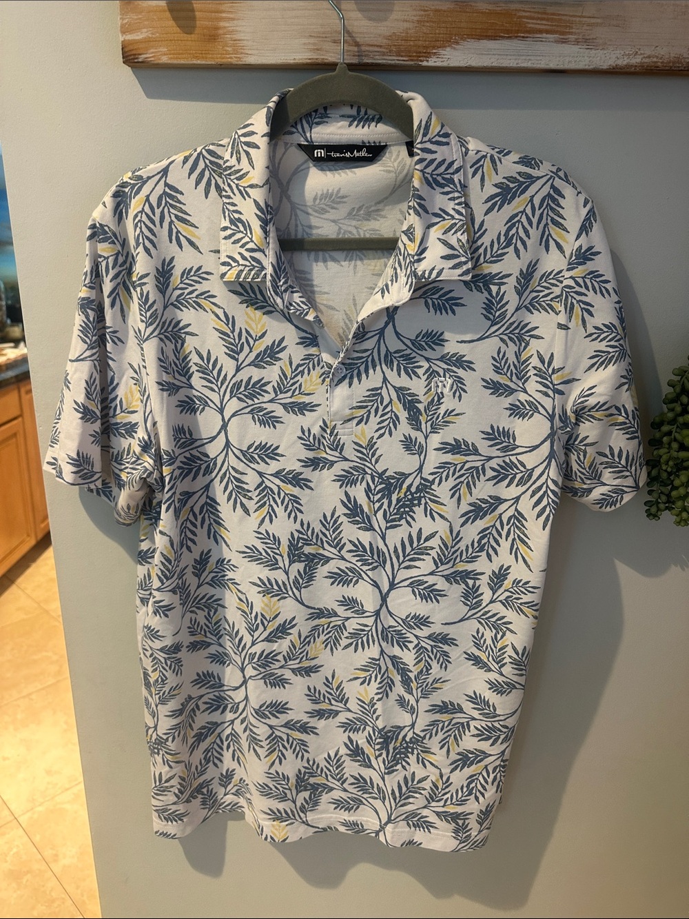 Travis Mathew White Polo with Blue and Yellow Leaf Print
